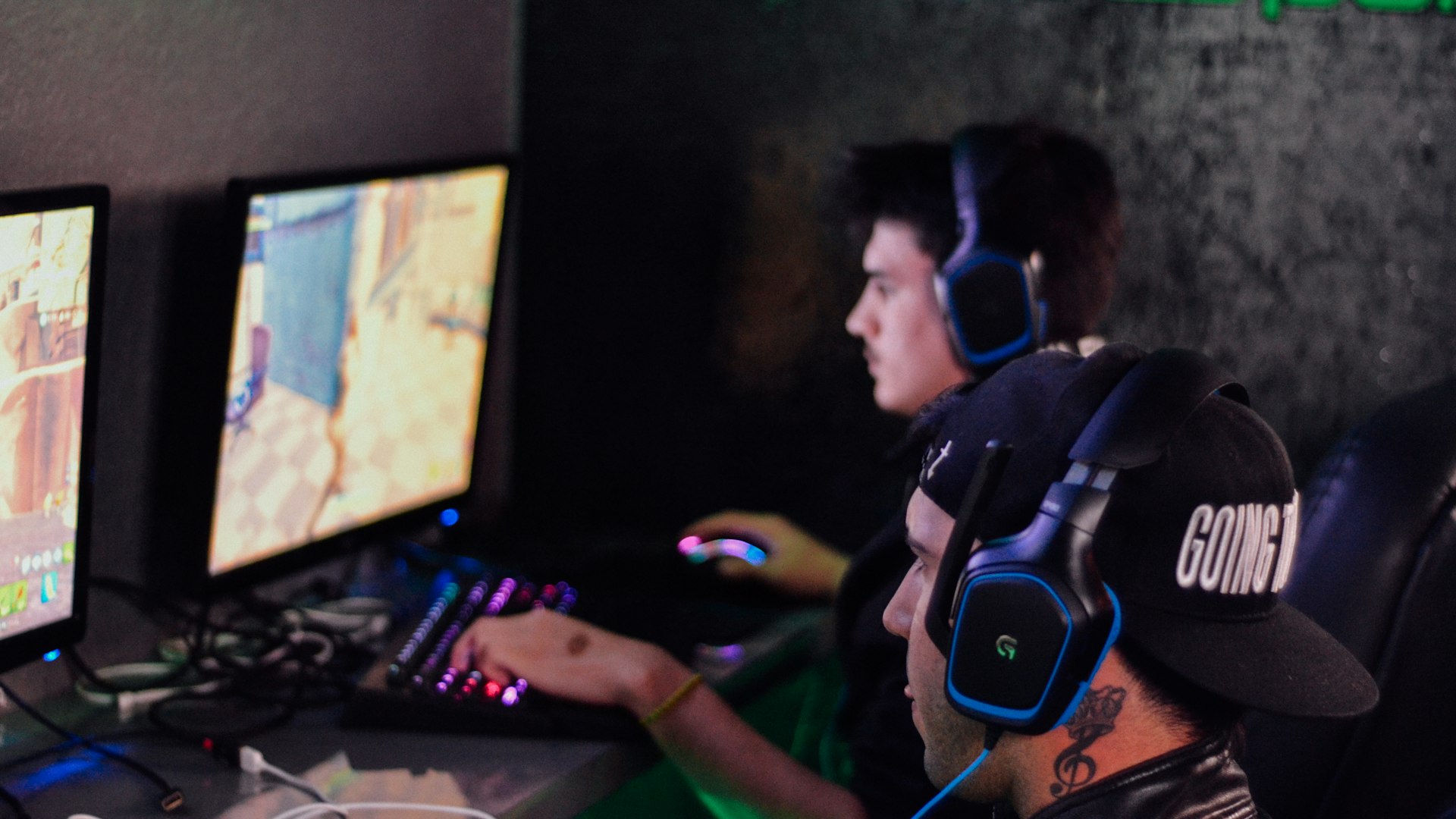 Neon-lit gaming setup glowing in the dark